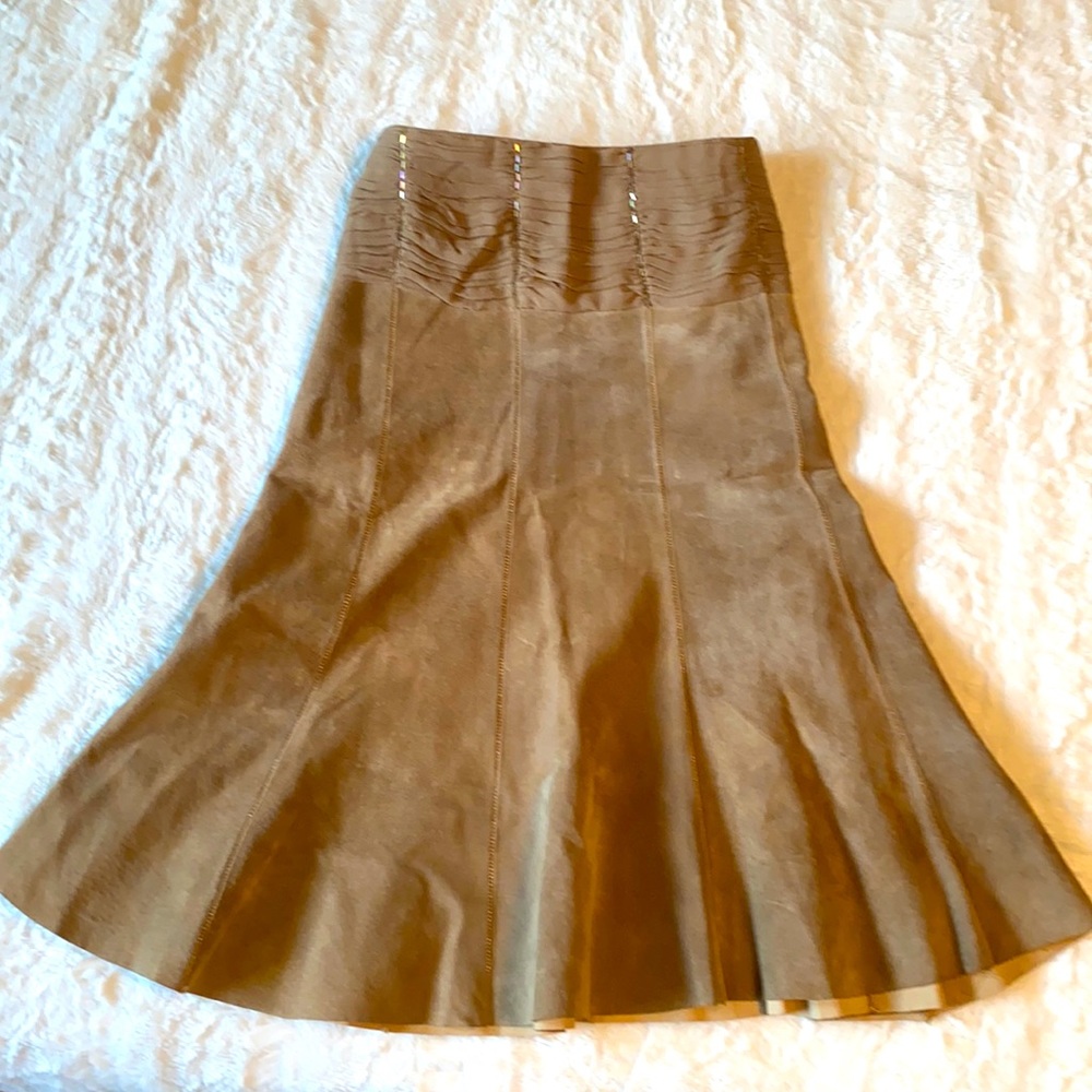 Genuine suede tulip skirt with beading embellishment and crepe waist.